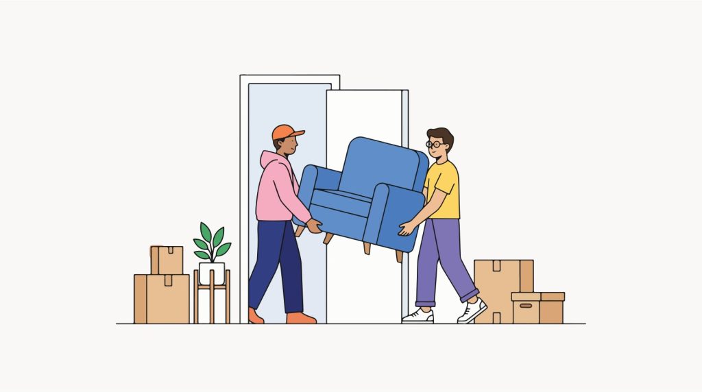 Twee verhuizers dragen een blauwe fauteuil door een deuropening